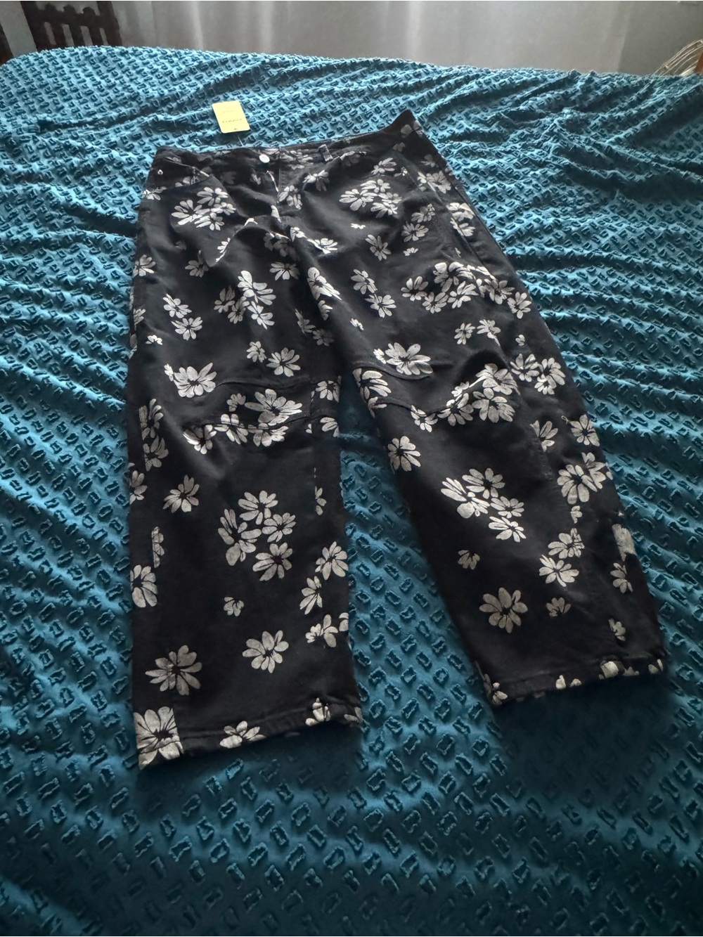 NWT Black barrel jeans with floral detail.